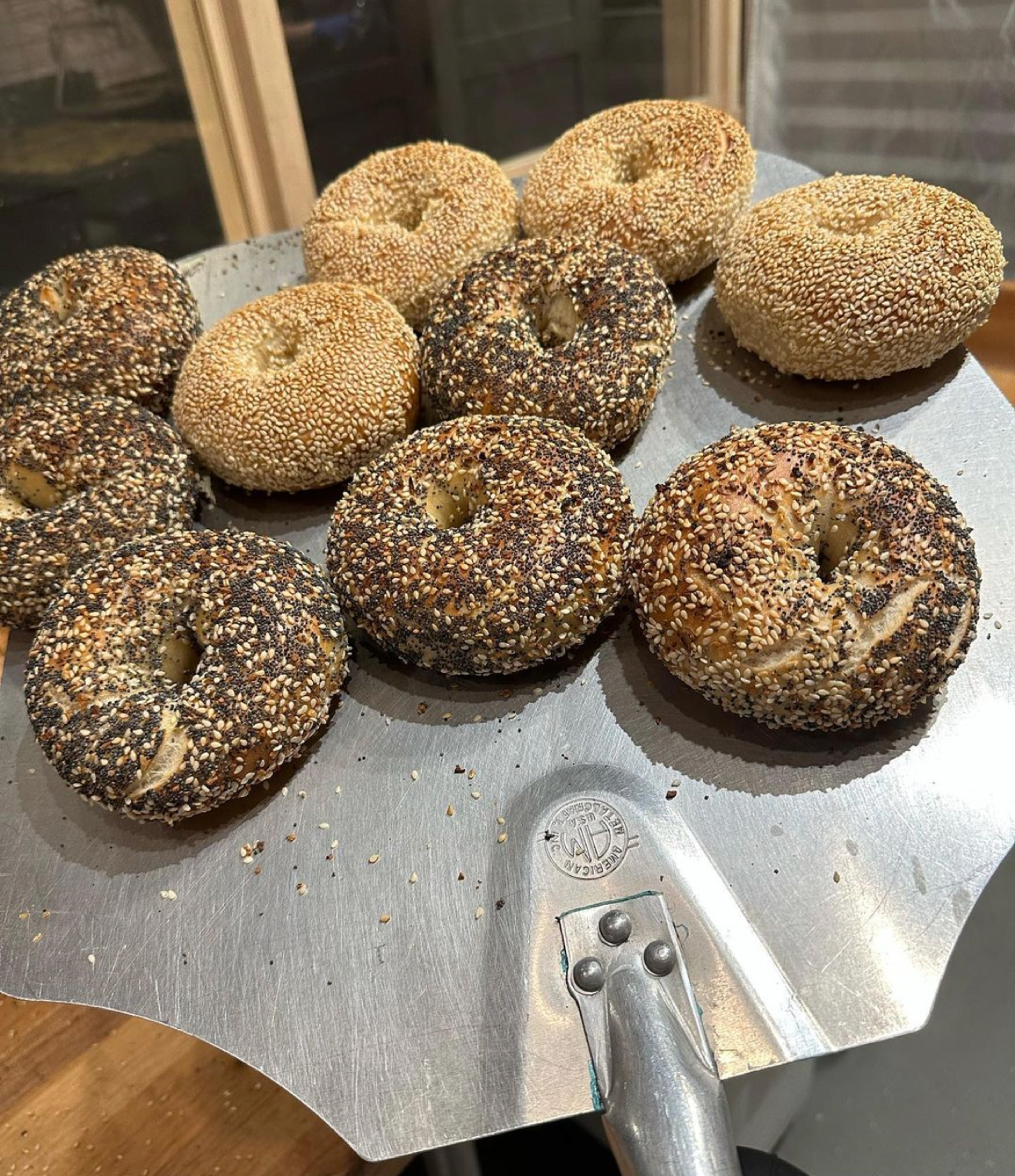 fresh baked bagels coming out of the oven