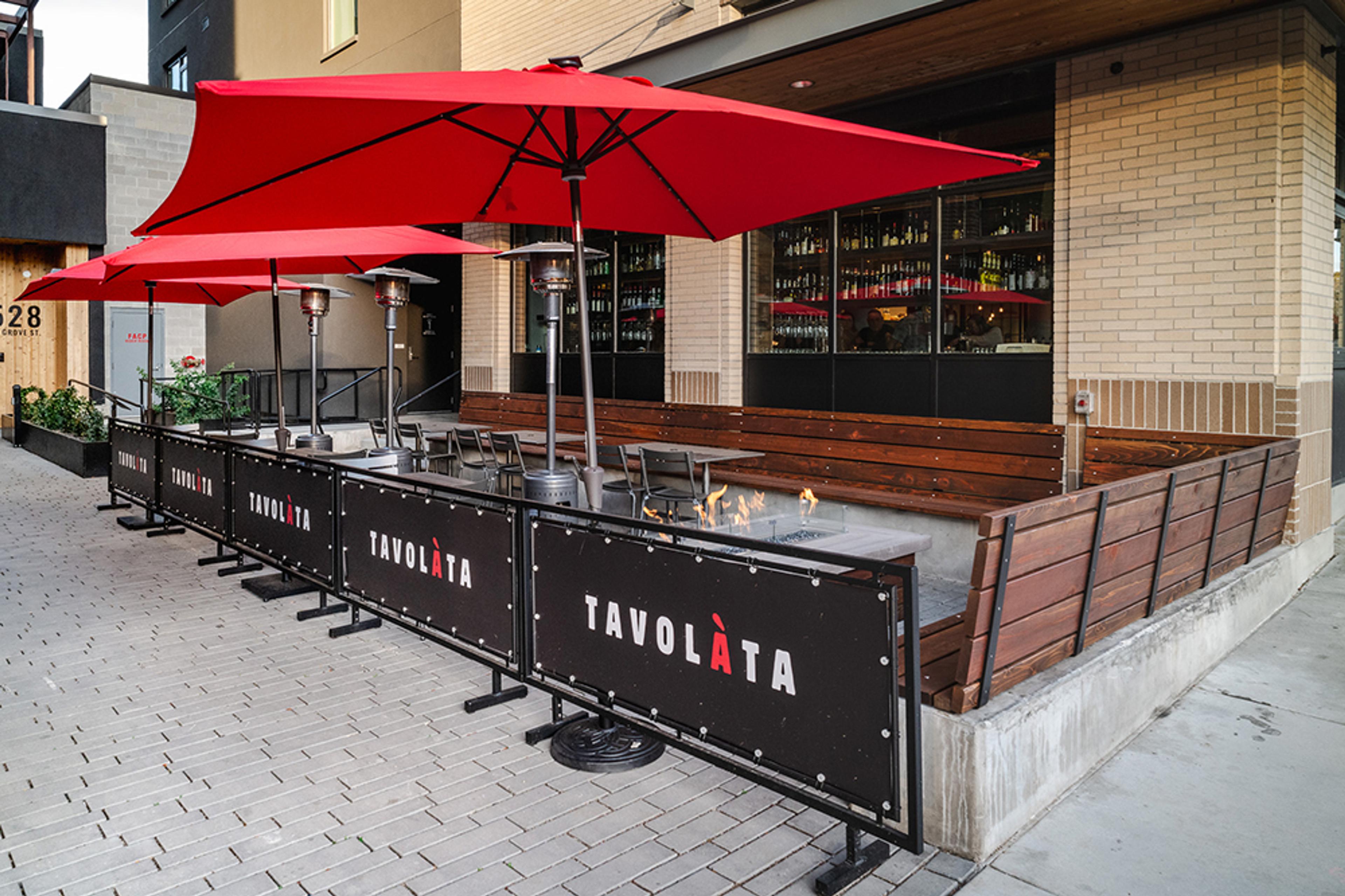 Patio with fire pit and umbrellas