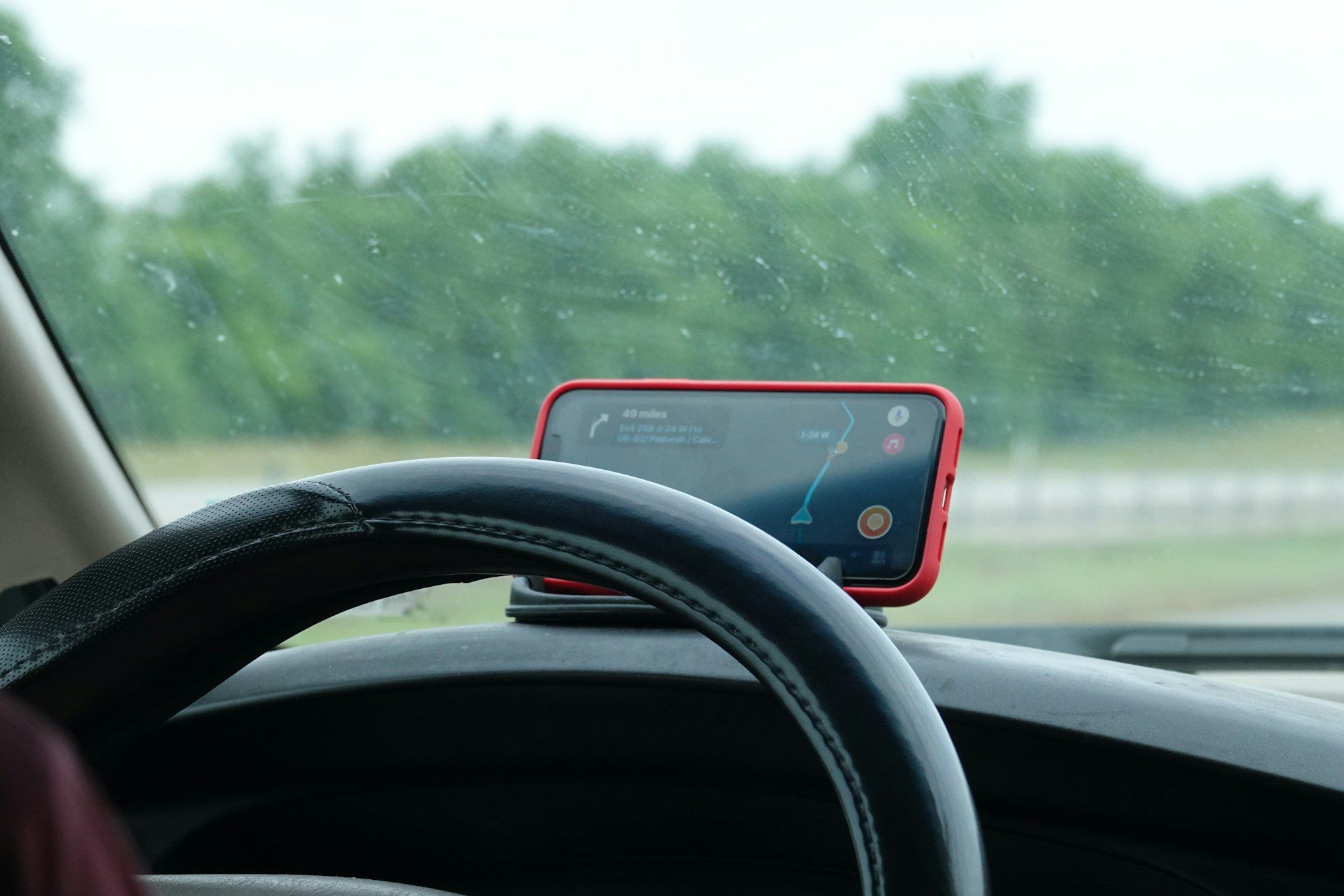 A road trip route open on a dashboard-mounted phone