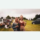 Friends at an outdoor vehicle and camping gathering in Germany