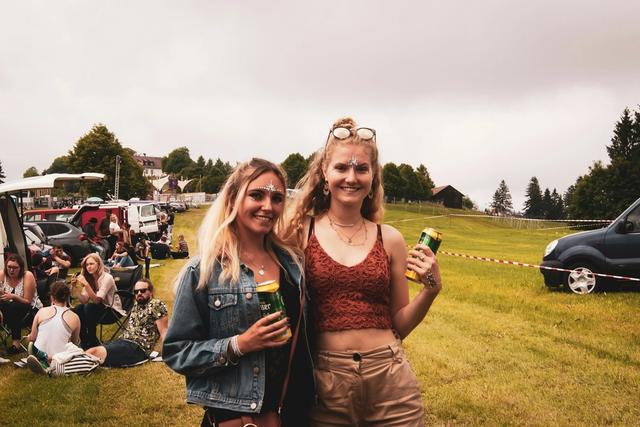 Friends at an outdoor vehicle and camping gathering in Germany