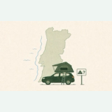 Green SUV with a rooftop tent in front of a map of Portugal