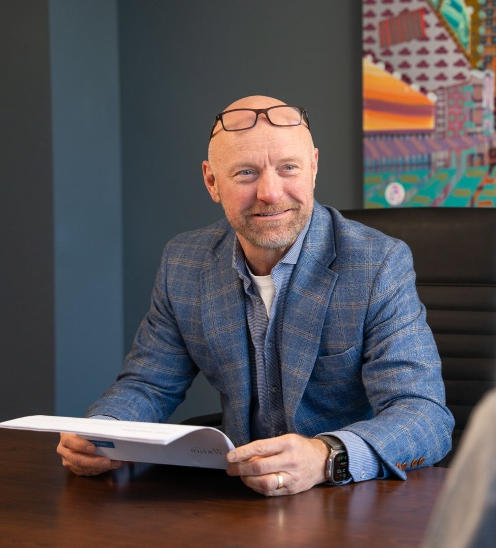 Jason Vincent, Co-founder smiling with a client