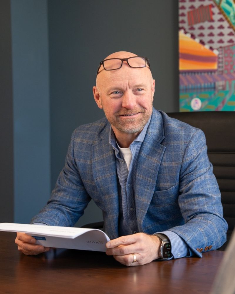 Jason Vincent, Co-founder smiling with a client