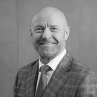 Profile headshot of President & COO Jason Vincent