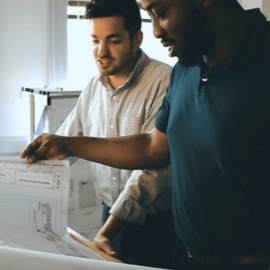 Two people looking at paperwork