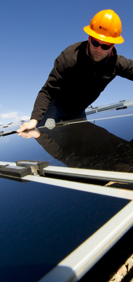 Engineer touching a solar panel