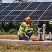 Worker hooking up solar panel