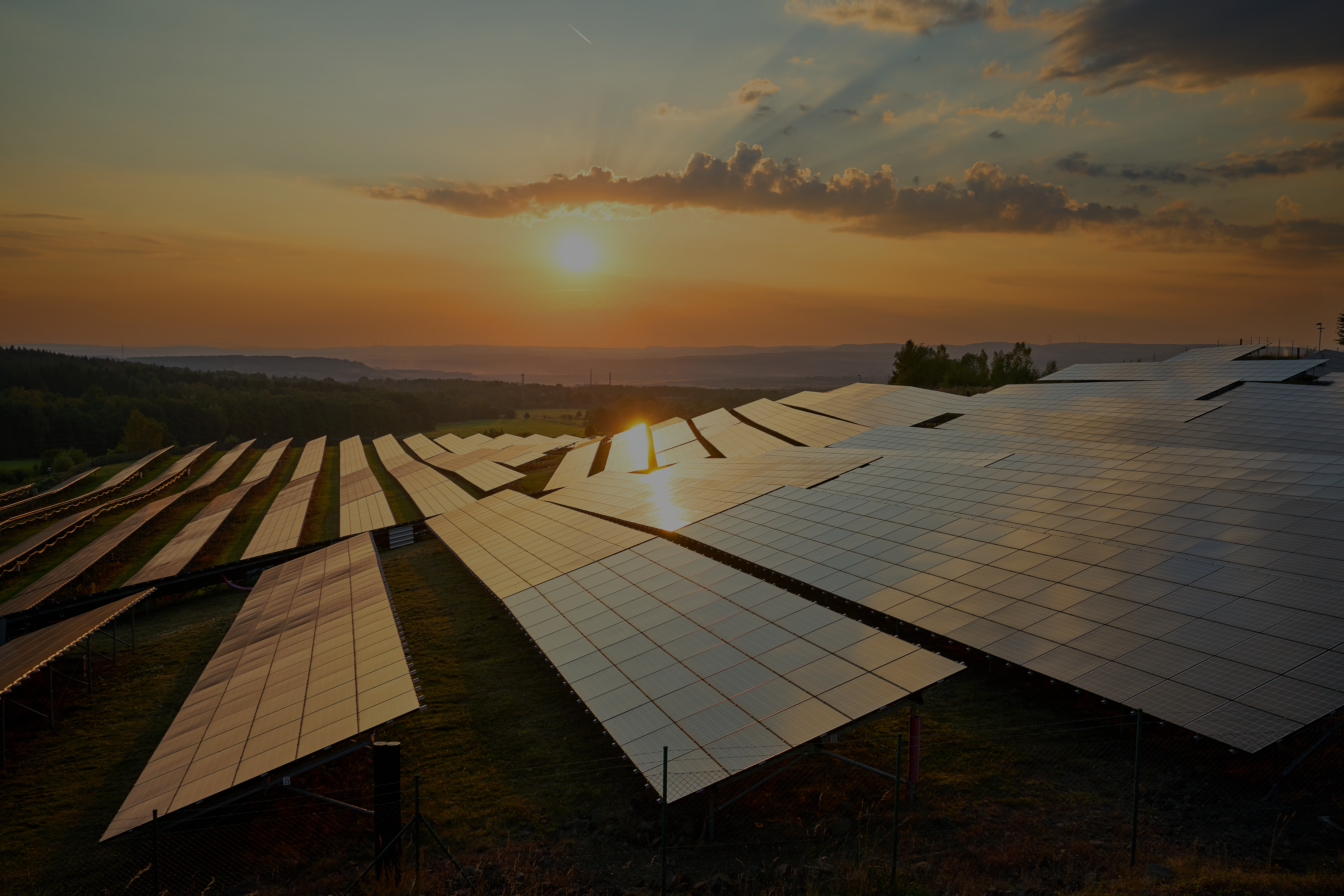 Sunrise with solar panels in the foreground