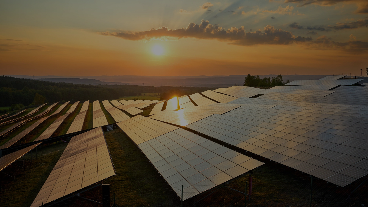 Sunrise with solar panels in the foreground