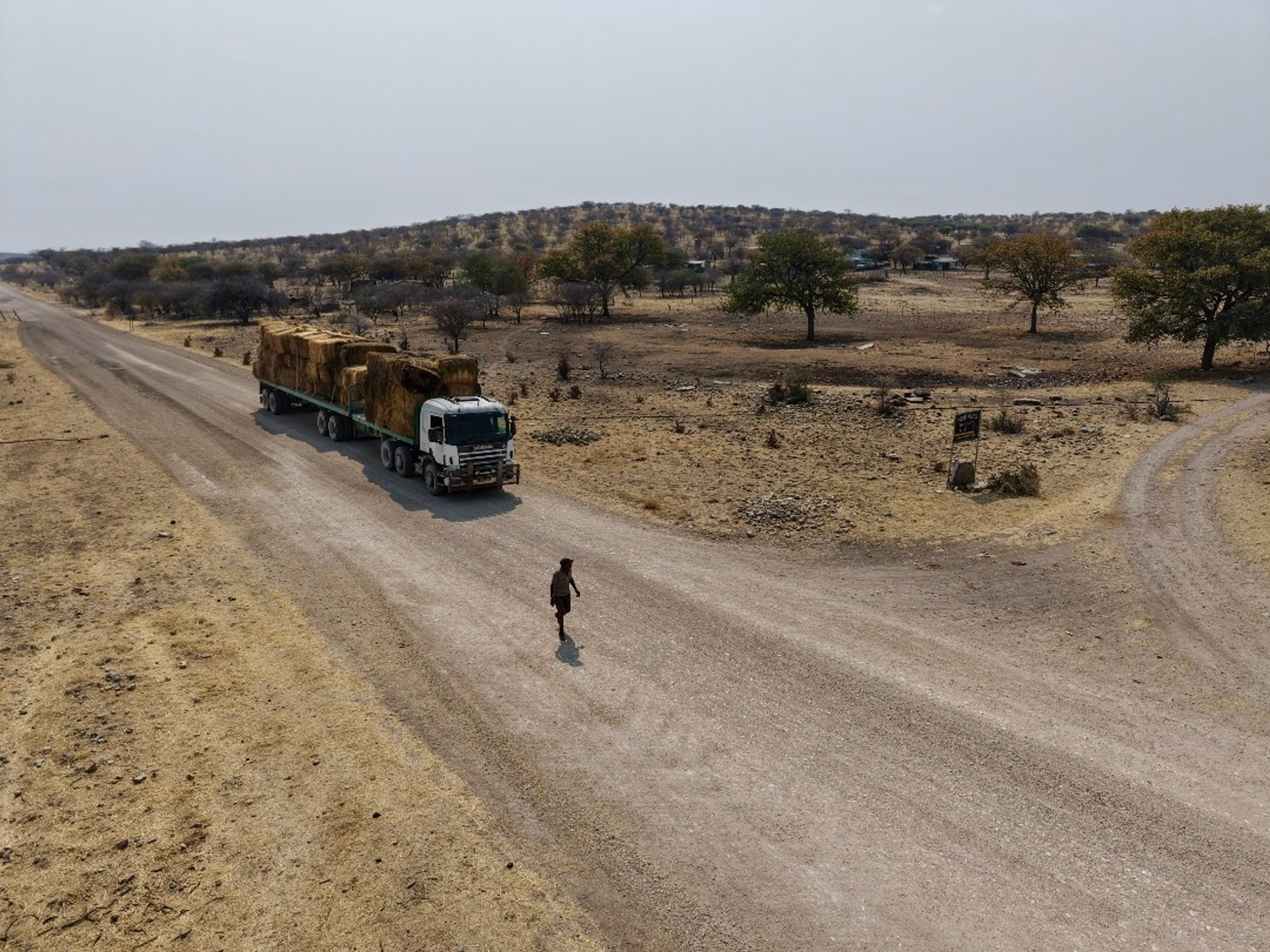 Ongava’s truck brings much-needed grass to the Hai//om Etosha San community, a simple gesture with a profound impact.