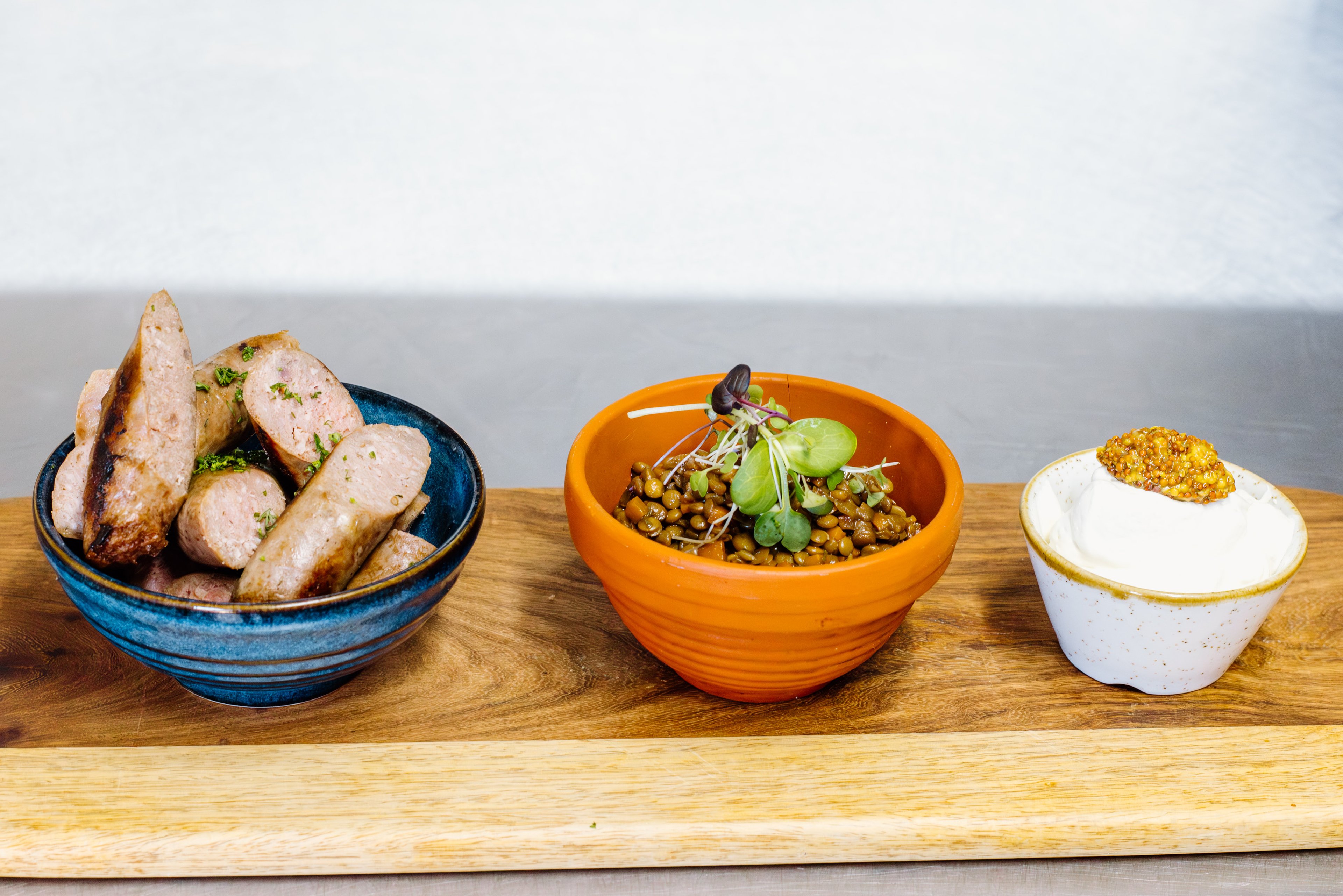 Game sausage served with lentil ragout, mustard Chantilly, and a touch of apple cider vinaigrette.