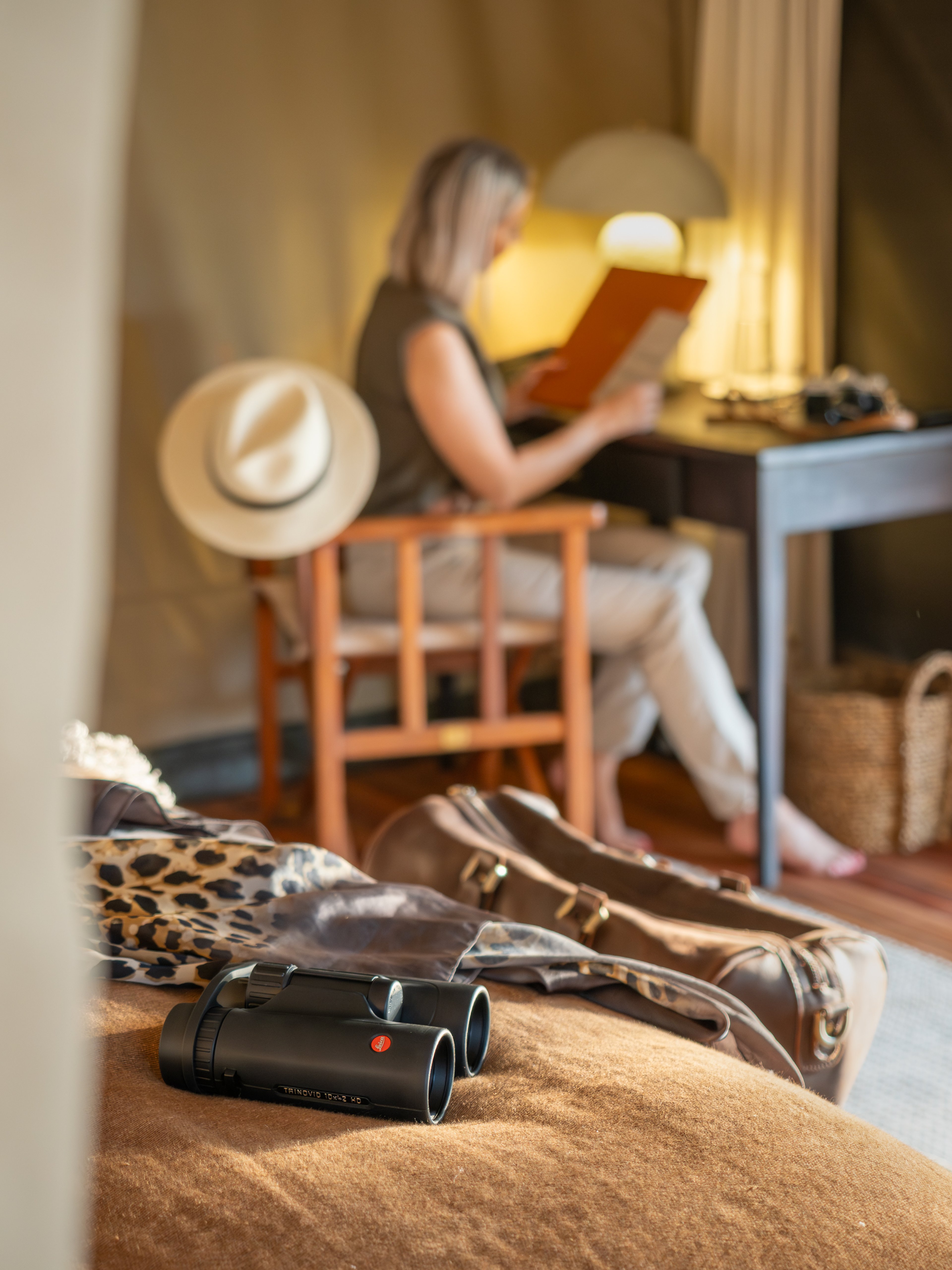A lady leisurely reading at her desk at Horizon