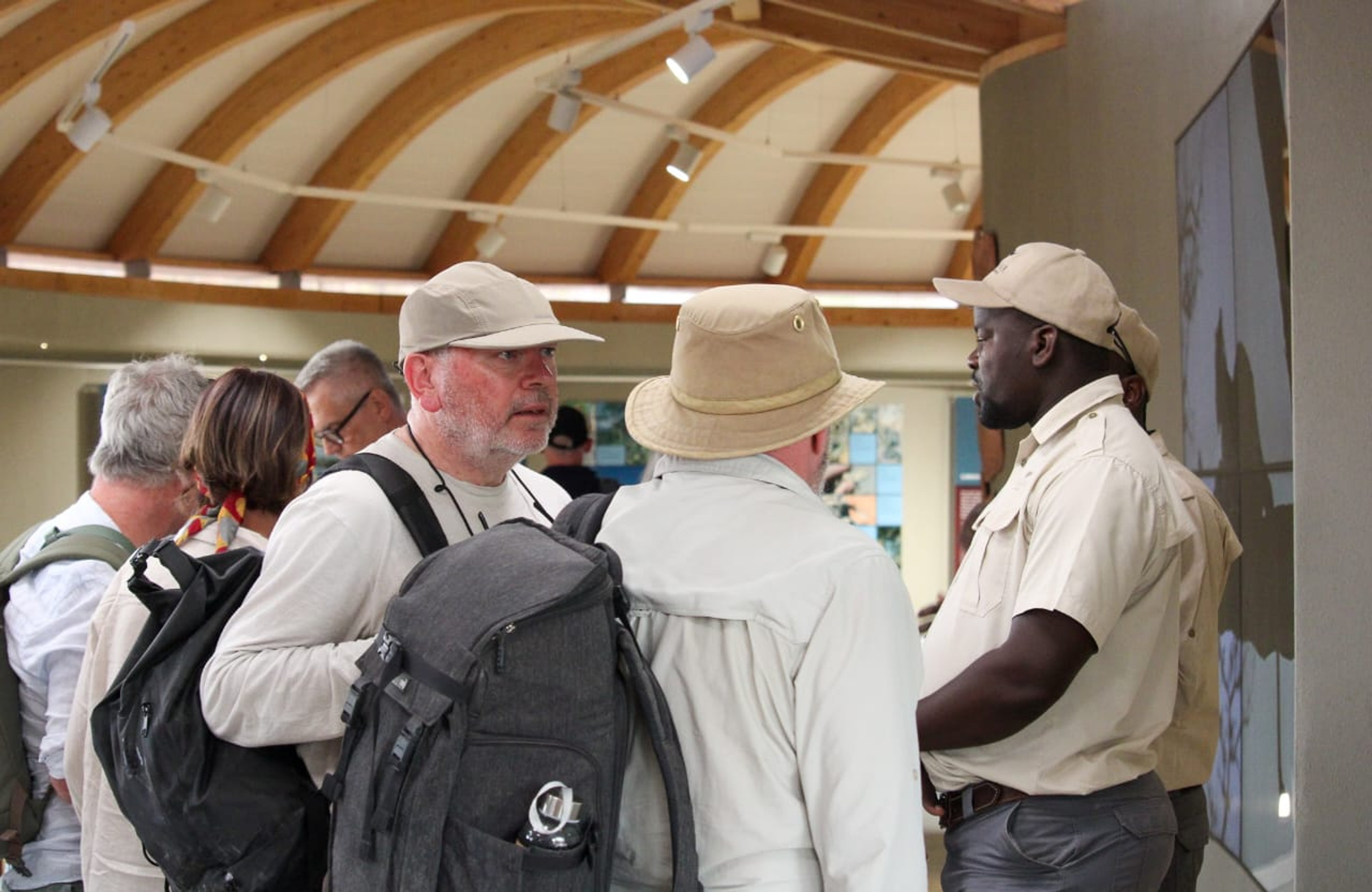 Guests and guides engaging in conversations about rhino conservation.