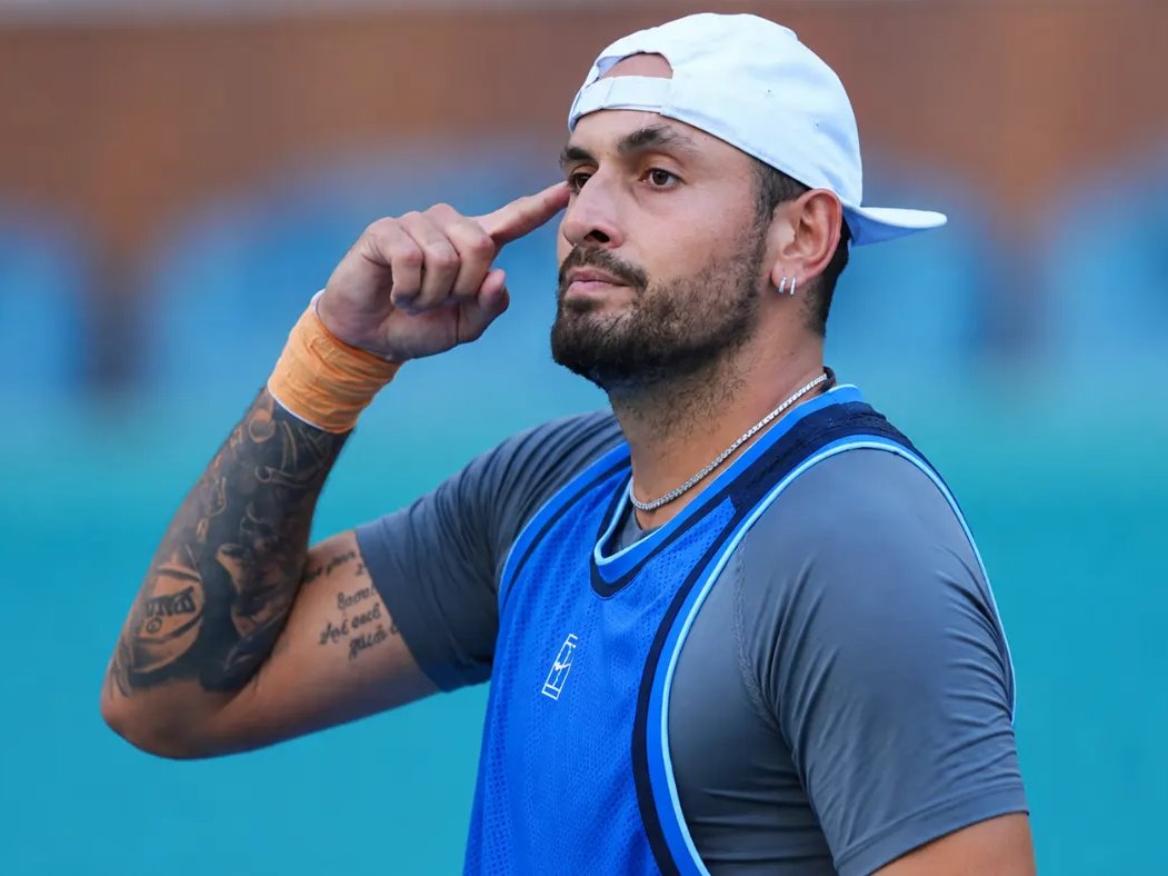 Kyrgios pointing to his head