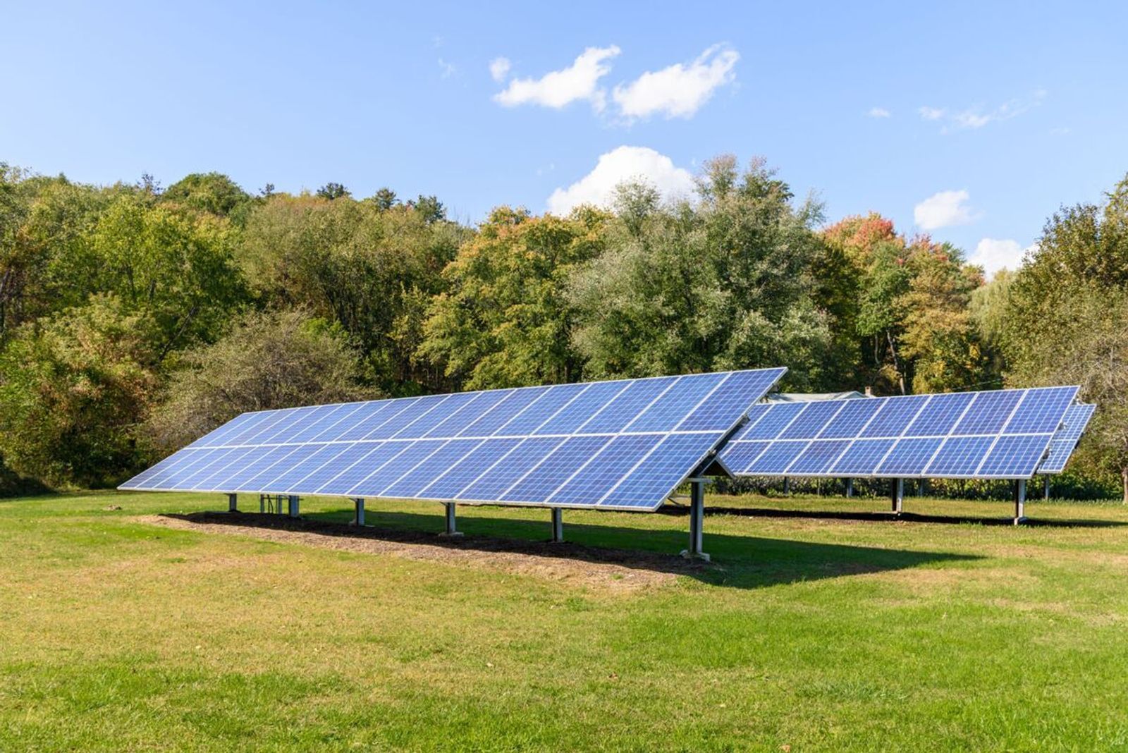 Ground-mounted solar array expertly installed on agricultural farmland