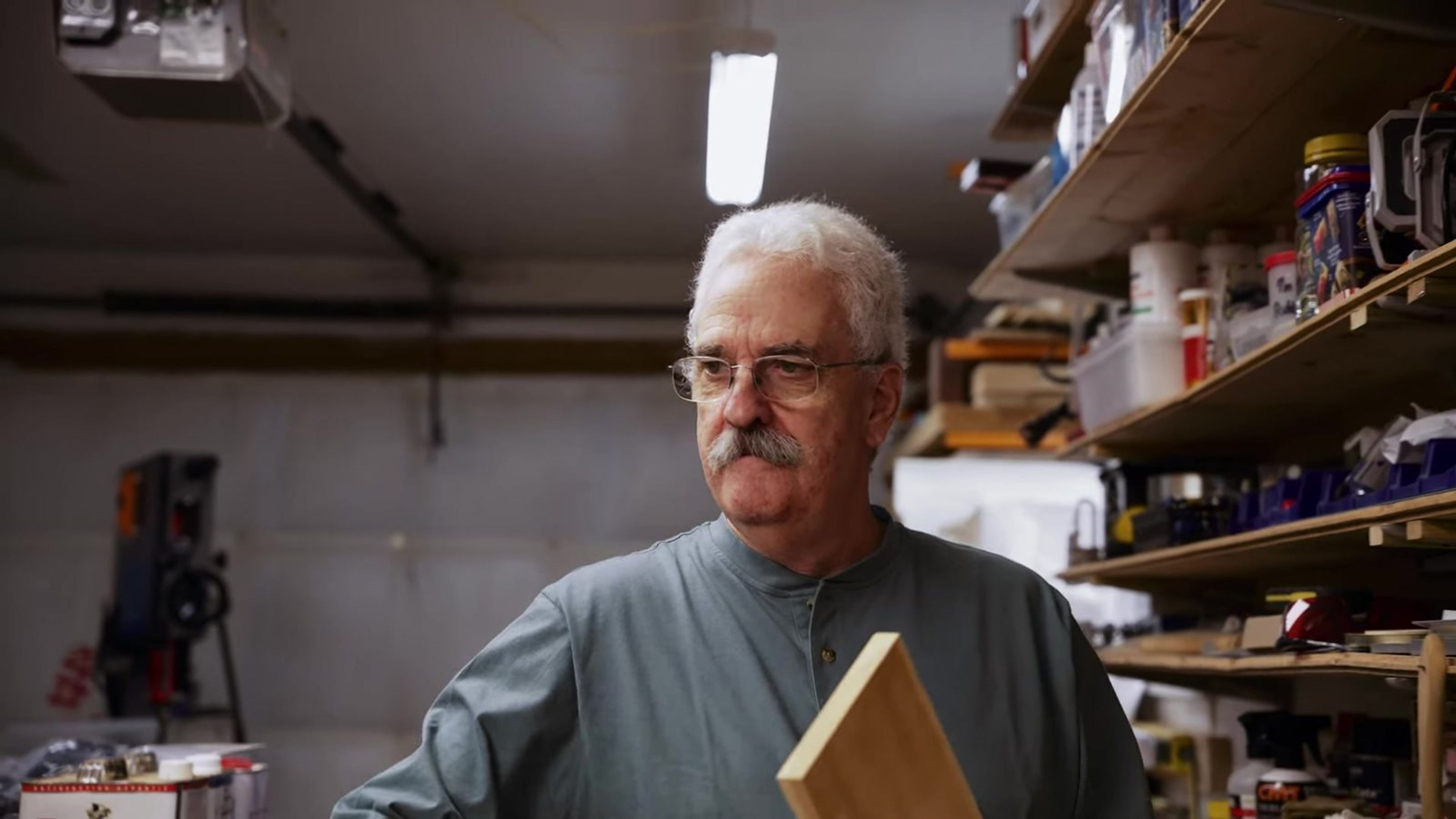 Marc in the woodworking shop attached to his home