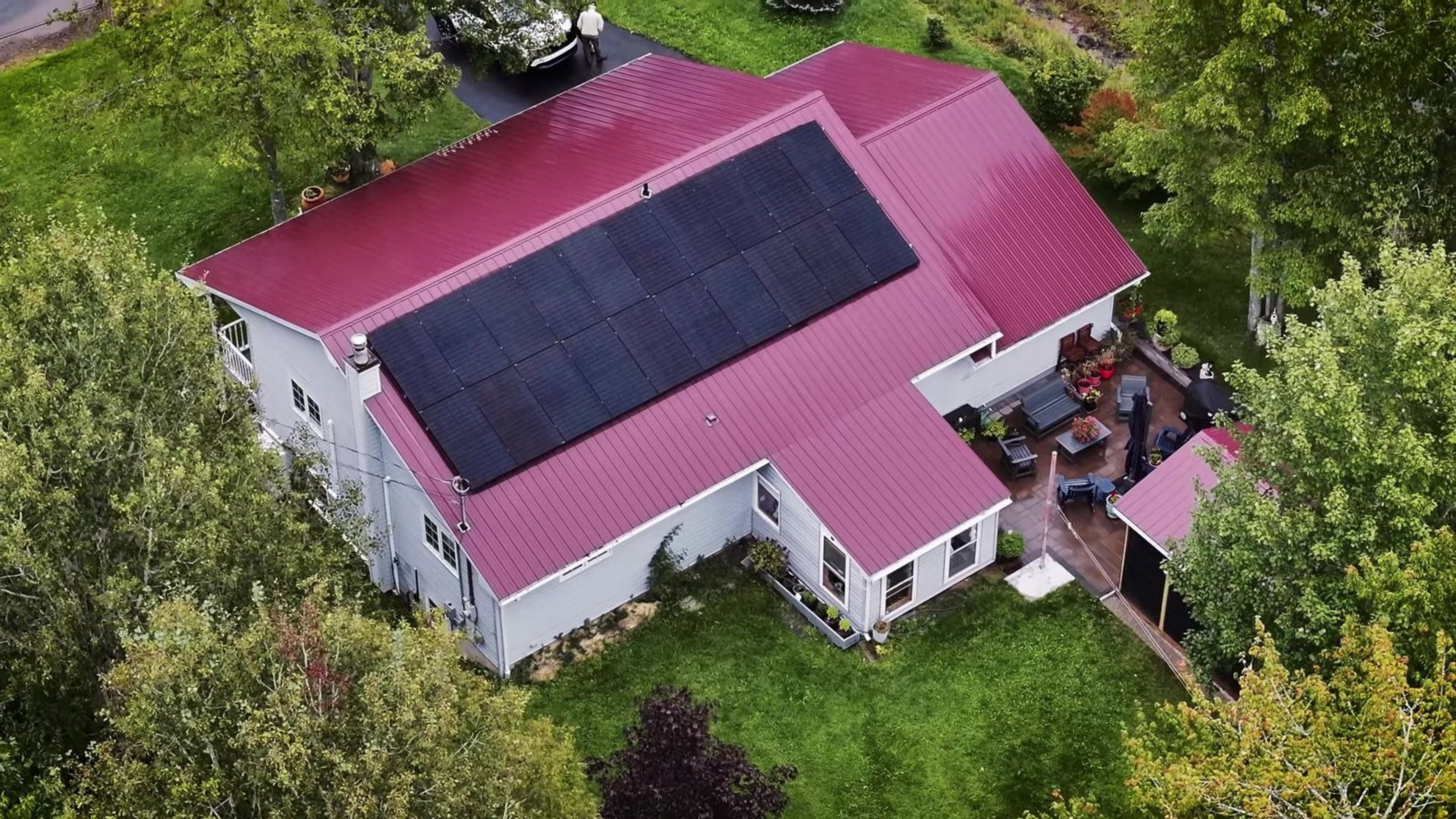Aerial view of the solar array on Marc and Phoebe’s red metal roof