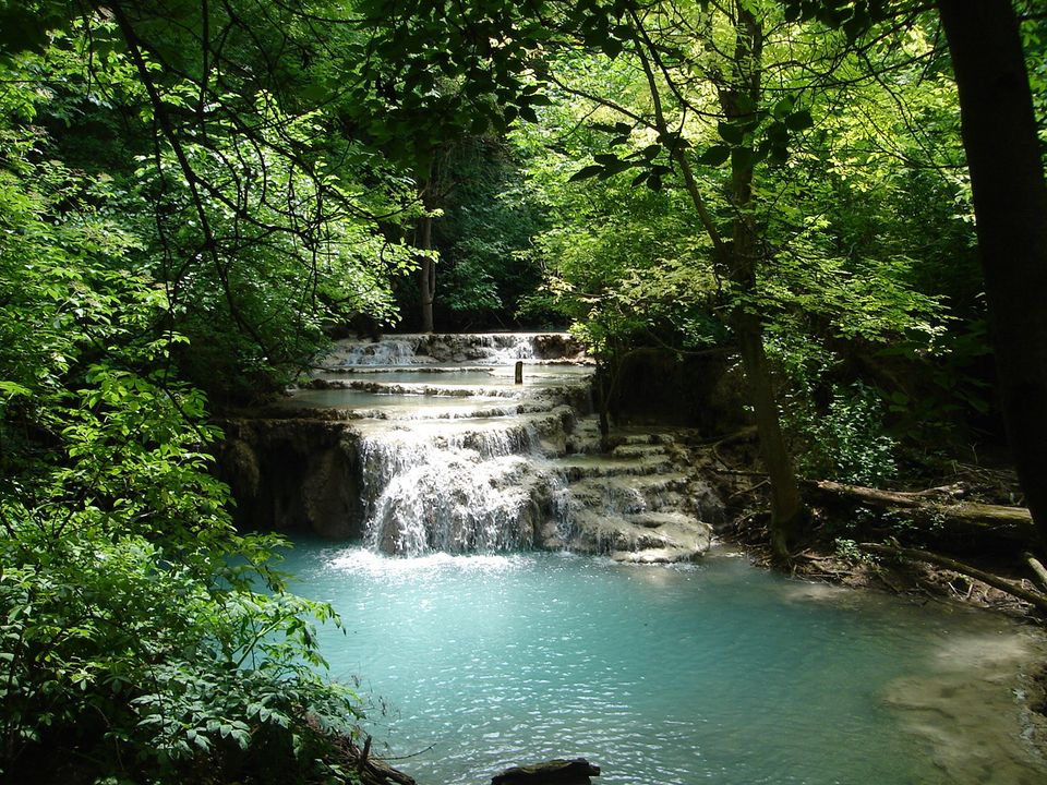 A waterfall and turquoise pool at Krushuna