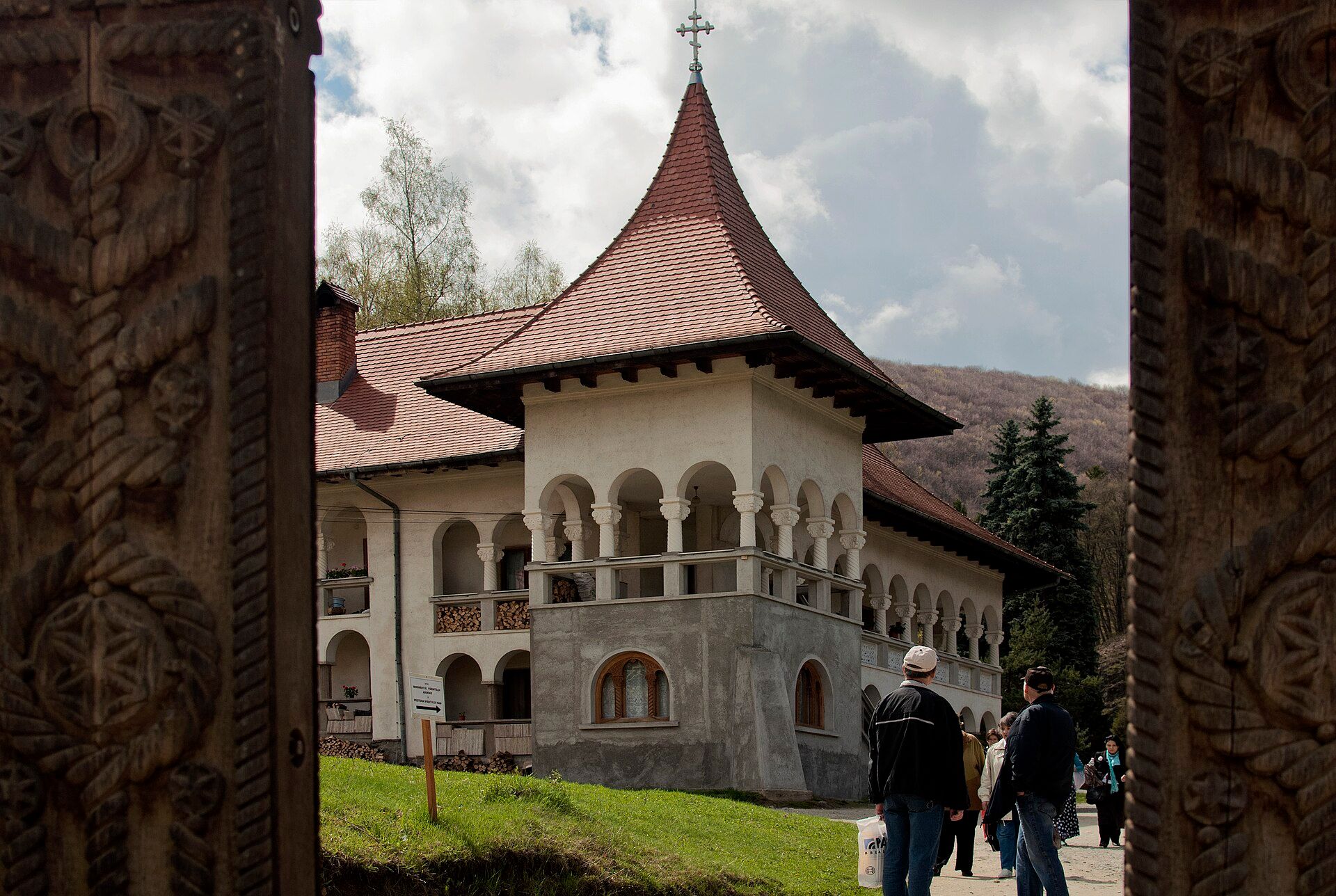 Prislop Monastery seen through its carved wooden gate