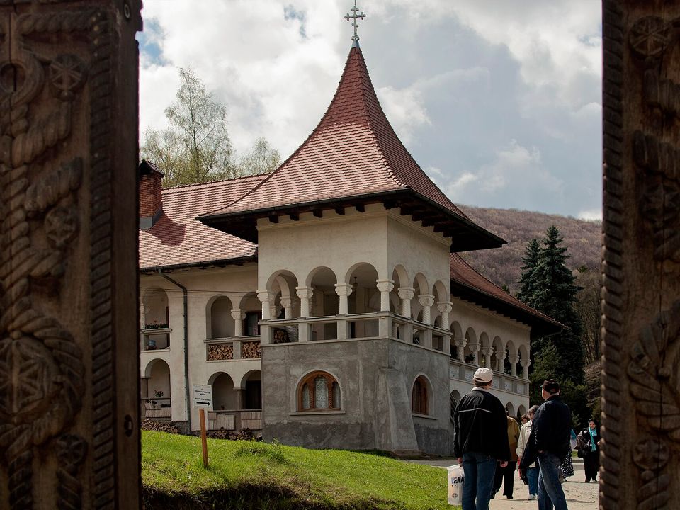 Prislop Monastery seen through its carved wooden gate