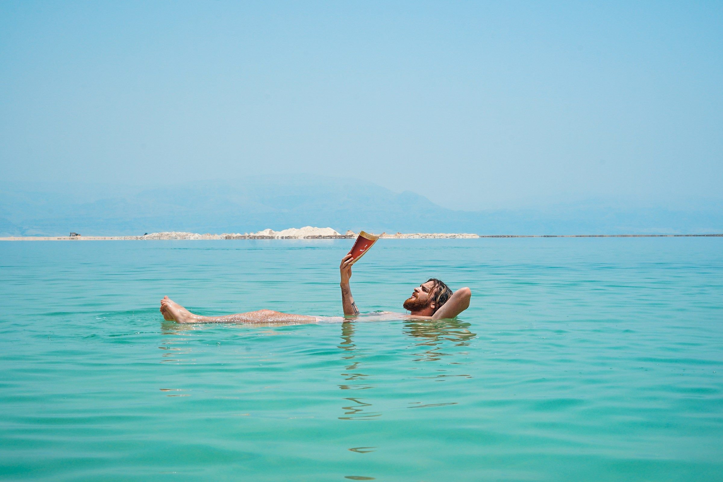 Floating and reading in the Dead Sea
