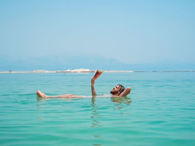 Floating and reading in the Dead Sea