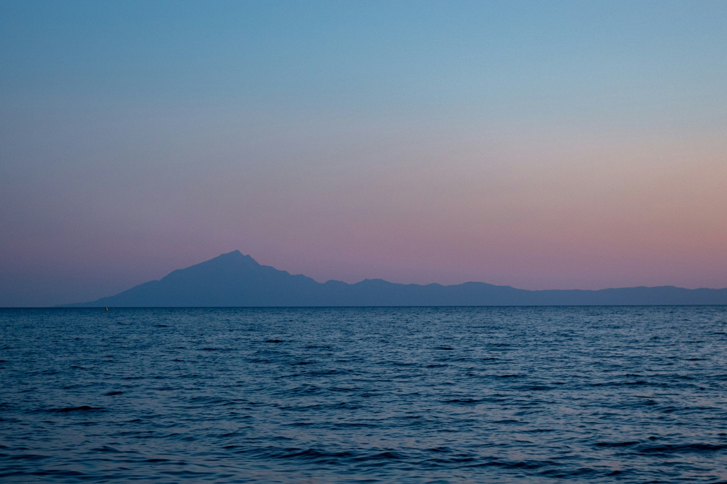 Mount Athos across the sea at dusk