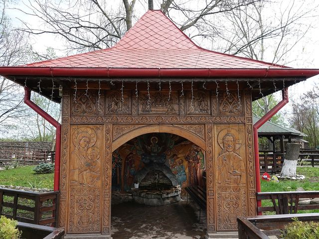 A carved wooden shrine in the Ghighiu Monastery courtyard