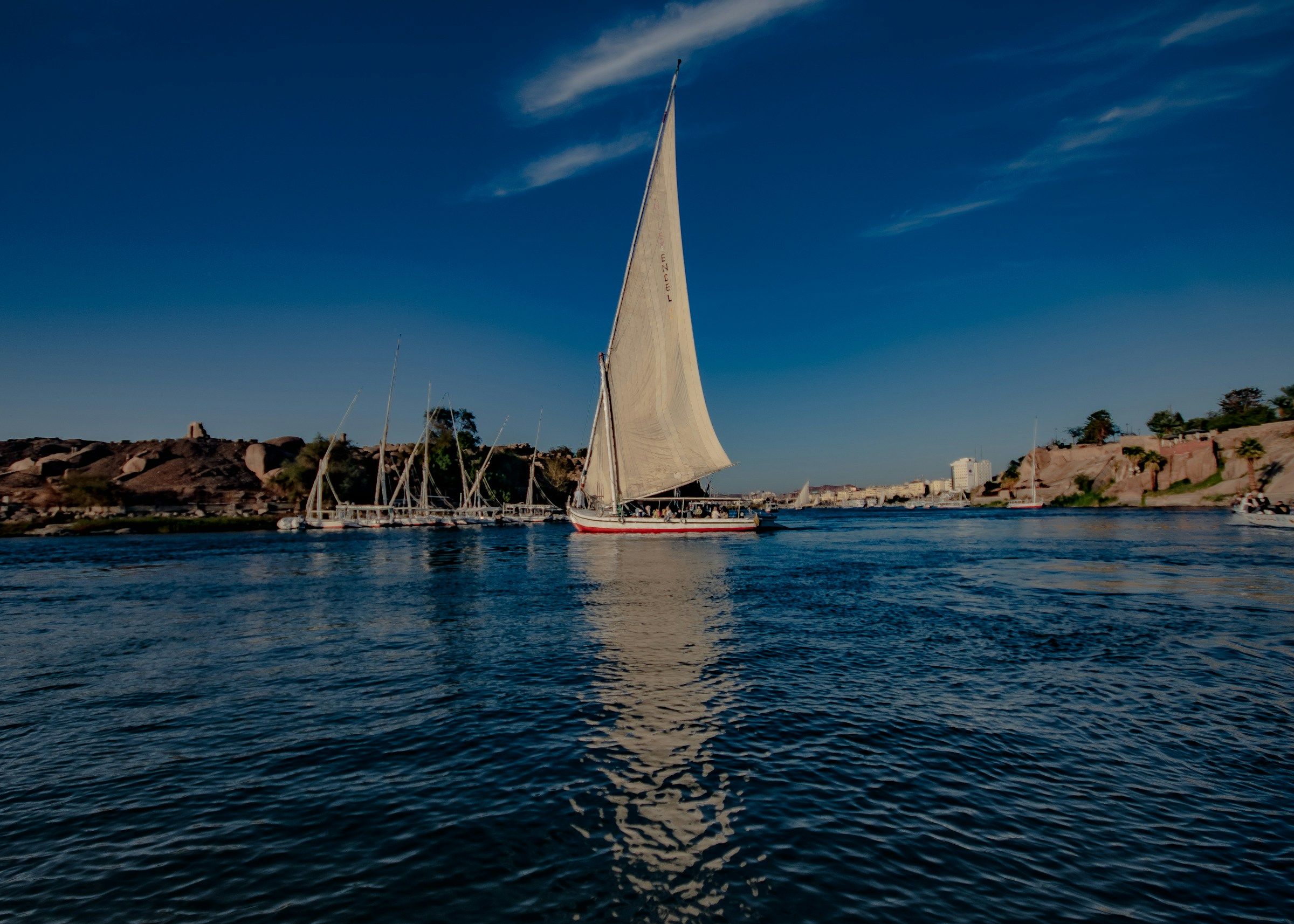 A felucca on the Nile at Luxor under a clear sky