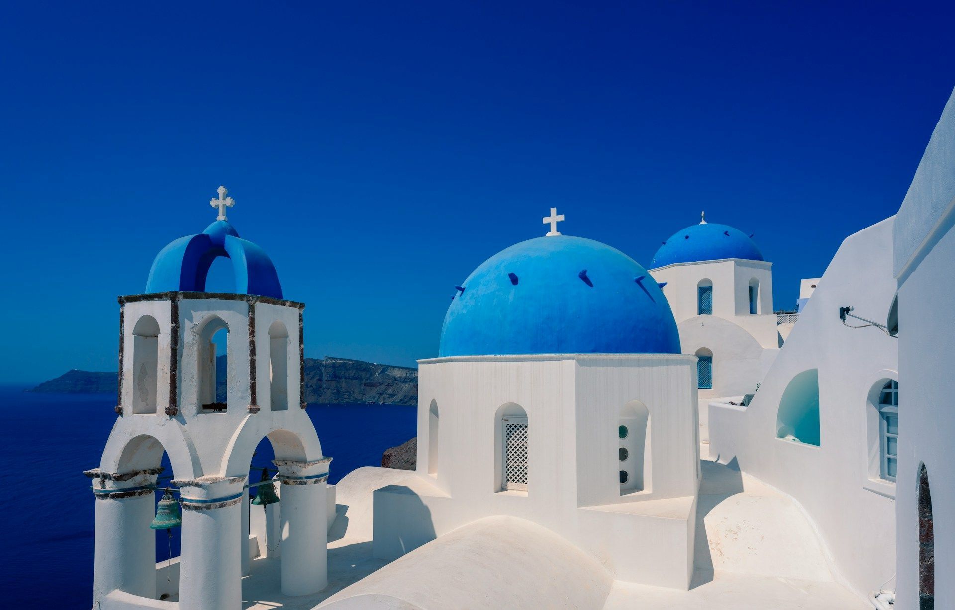 White churches with blue domes in Santorini