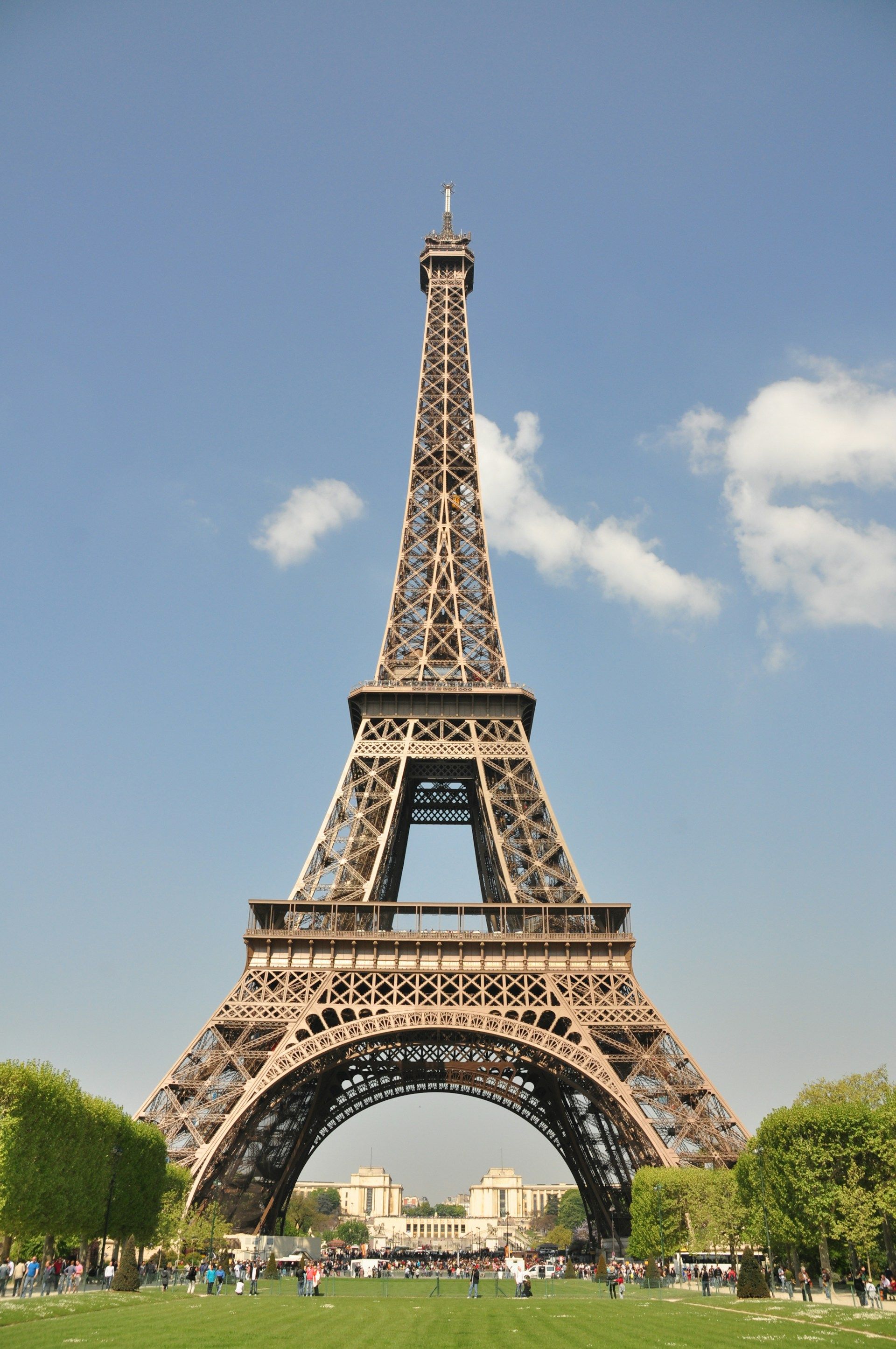 The Eiffel Tower in Paris against a cloudy sky