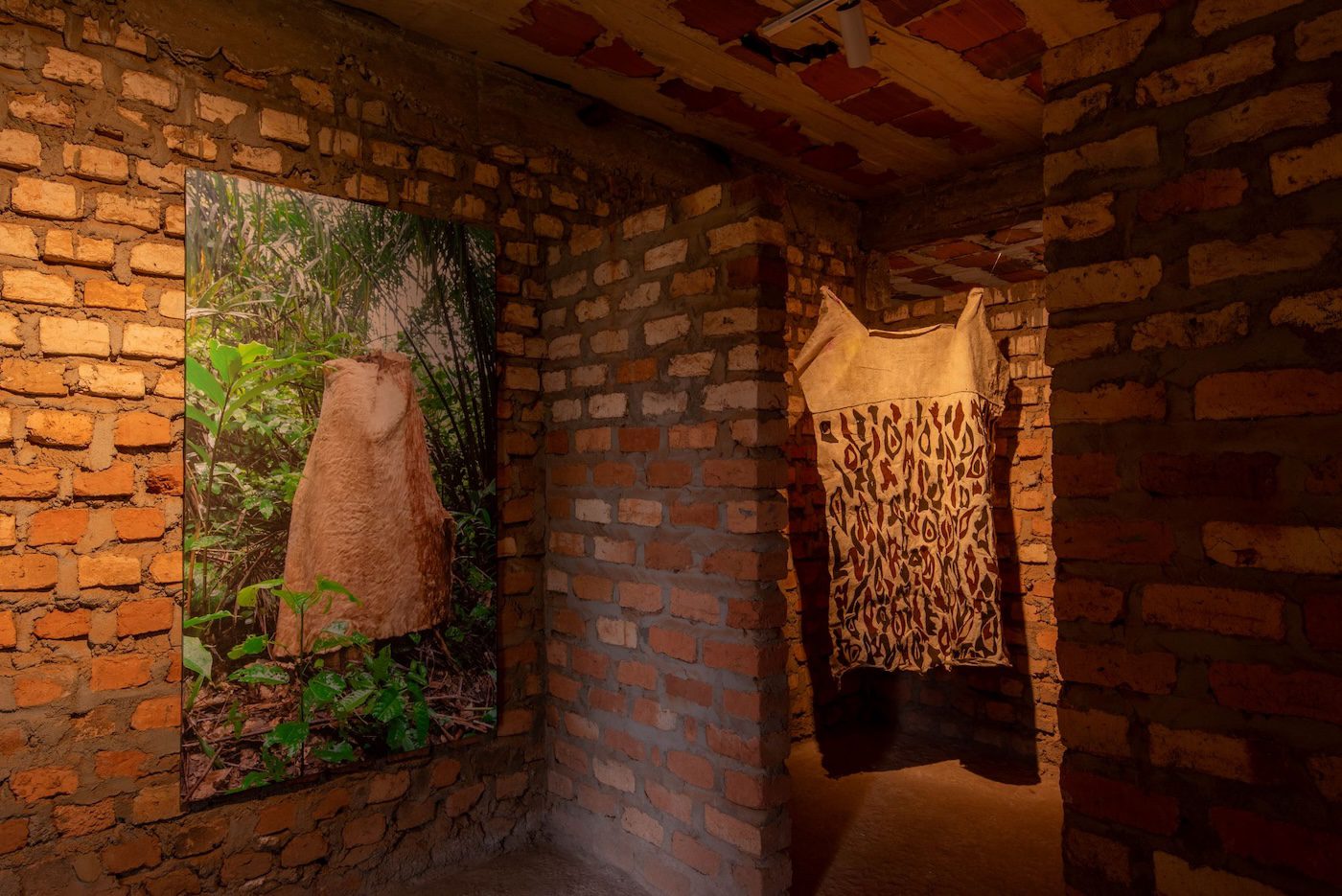 Piloya Irene, Metaphors of Reflection (DAA II, III, IV and GOMSI), 2023, installation comprising photography and Kyenkyen barkcloth, variable dimensions at Silent Invasions: The Art of Material Hacking. Photo: Atiko Anthony