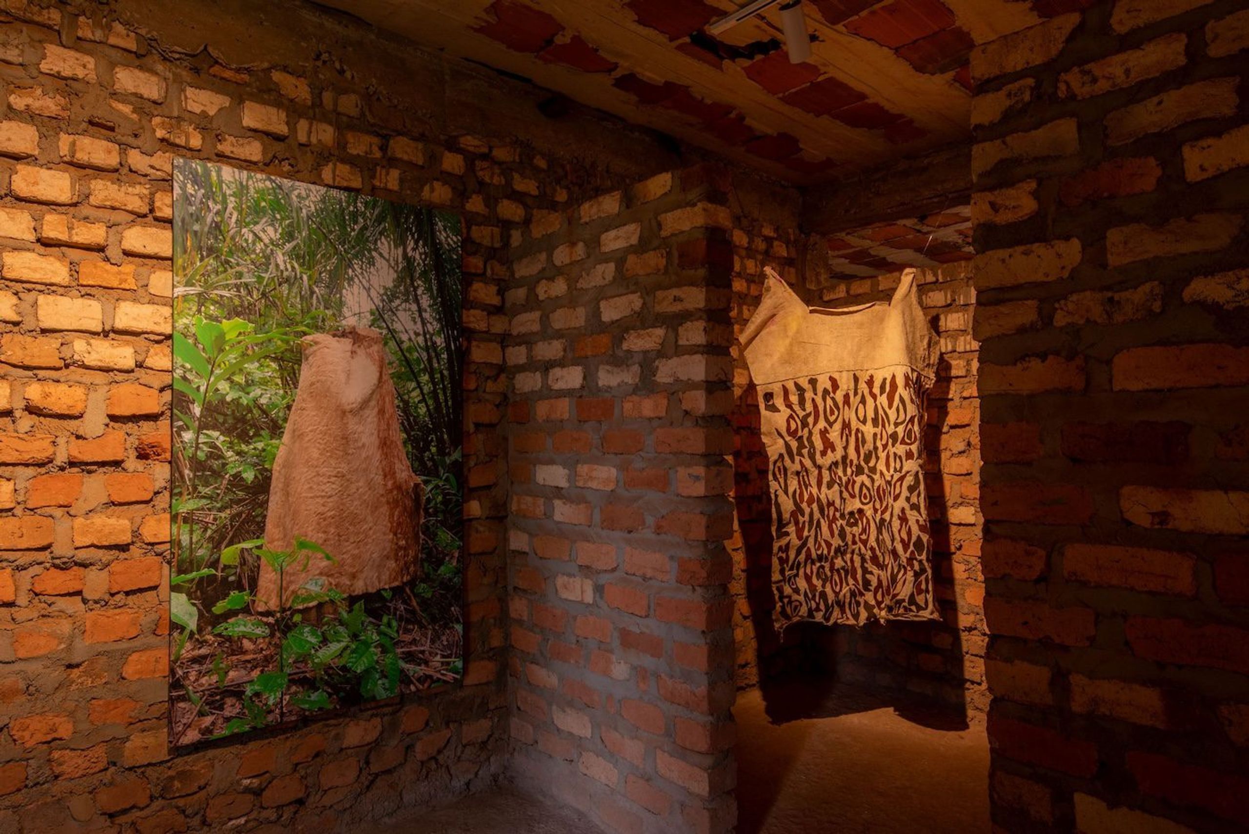 Piloya Irene, Metaphors of Reflection (DAA II, III, IV and GOMSI), 2023, installation comprising photography and Kyenkyen barkcloth, variable dimensions at Silent Invasions: The Art of Material Hacking. Photo: Atiko Anthony