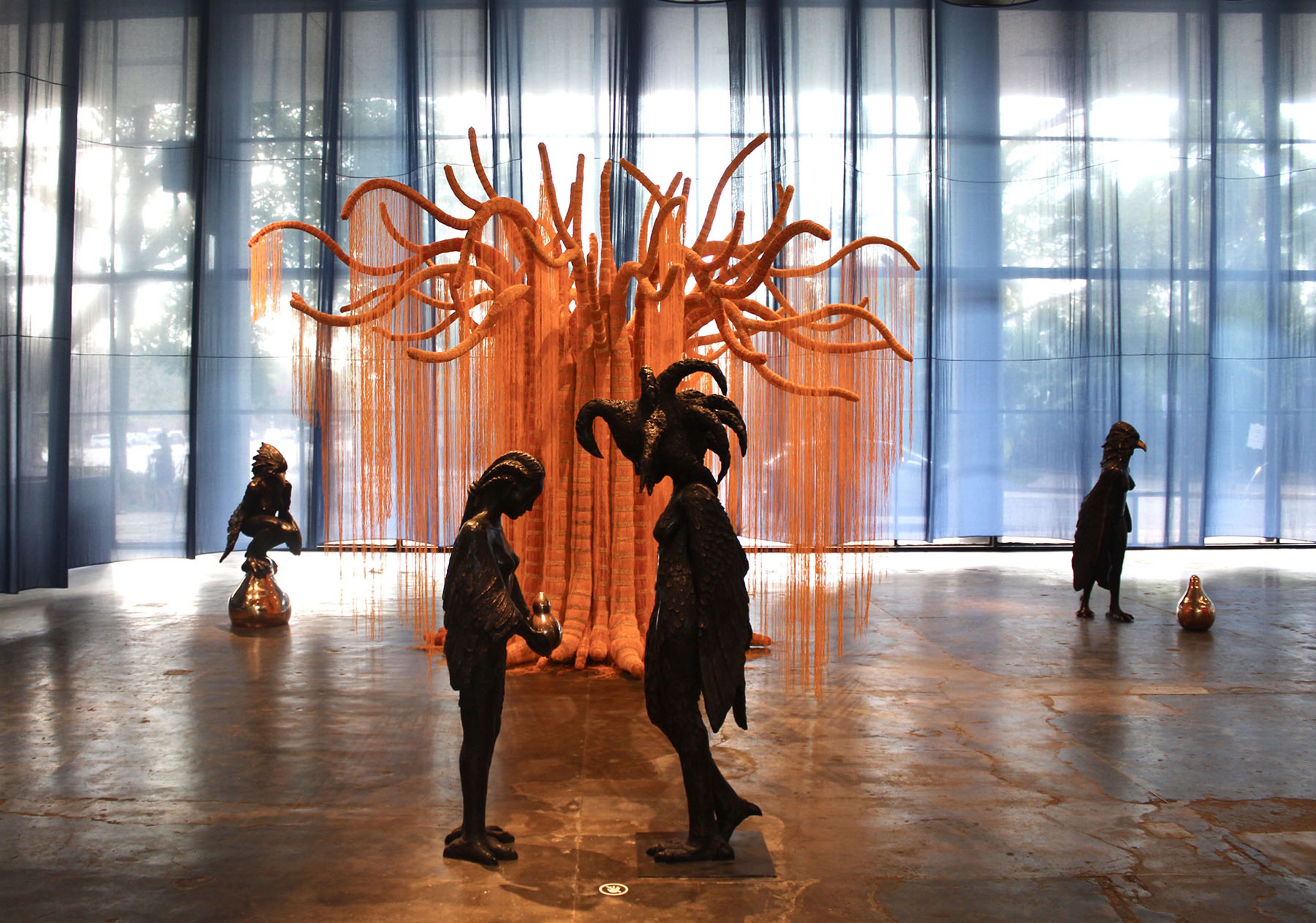 Nádia Taquary, Ìrokò: The Cosmic-Tree, 2025. Installation composed of bronze and fiberglass tree covered with glass beads. Courtesy: Paulo Darzé Galeria, Portas Vilaseca Galeria and Verve Galeria. Commissioned by Fundação Bienal de São Paulo for the 36th Bienal. Photo: Cristian Baena