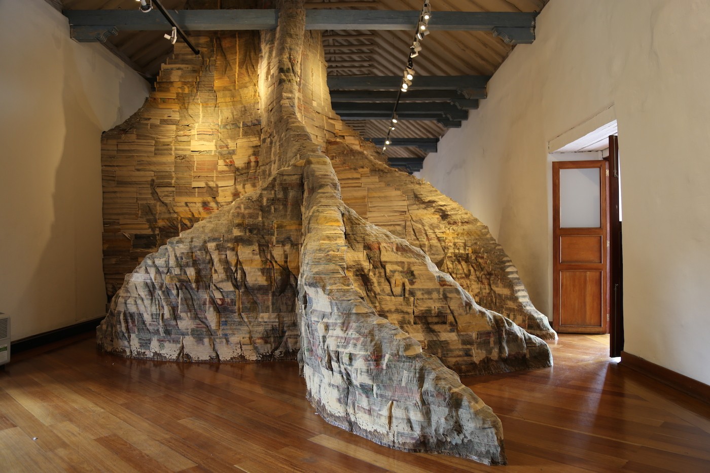 Miler Lagos, Nomads, 2014. Installation with two pieces. 40 tons of newspaper, piled and carved. Commissioned and produced by the National University of Colombia. Photo: Ana Luisa González.