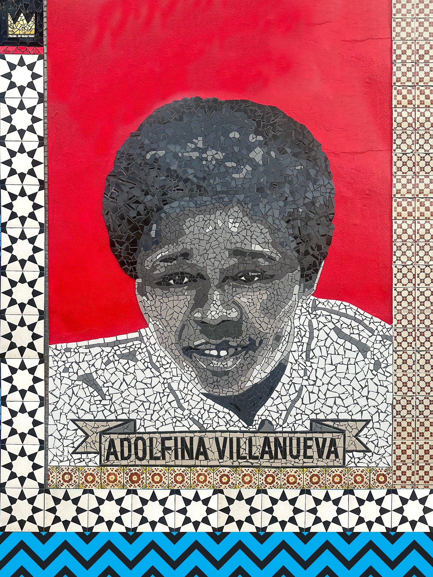 A mosaic portrait of a smiling child with dark hair against a red background, framed by patterned tiles. A banner below reads 'ADOLFINA VILLANUEVA'.