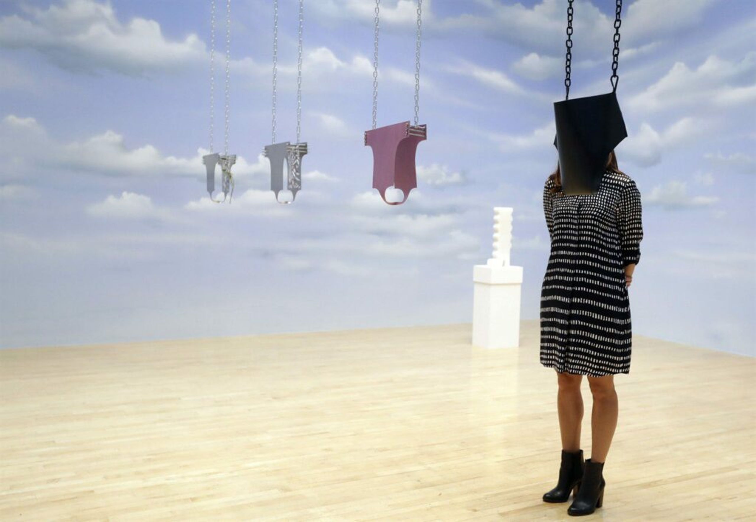 A woman looks towards part of an artwork called 'Lichen! Libido! (London!) Chastity!' by Anthea Hamilton, one of the four artists shortlisted for the Turner Prize 2016, as it is displayed at the Tate Britain gallery in London, Monday, Sept. 26, 2016. The Turner Prize aims to promote public debate around new developments in contemporary British art. (AP Photo/Kirsty Wigglesworth)