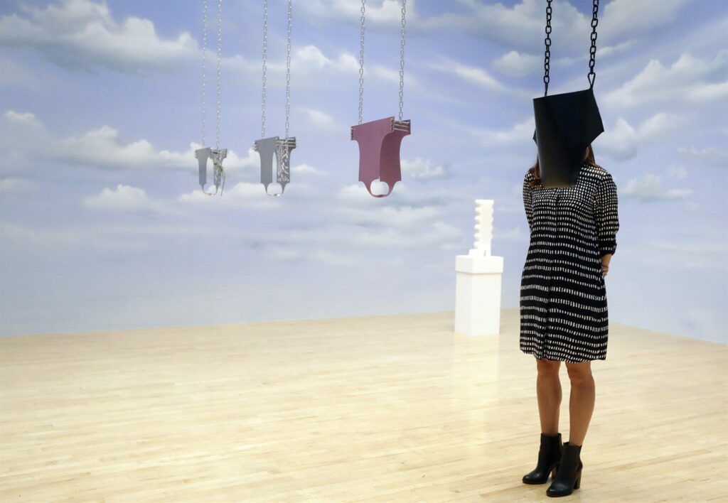 A woman looks towards part of an artwork called 'Lichen! Libido! (London!) Chastity!' by Anthea Hamilton, one of the four artists shortlisted for the Turner Prize 2016, as it is displayed at the Tate Britain gallery in London, Monday, Sept. 26, 2016. The Turner Prize aims to promote public debate around new developments in contemporary British art. (AP Photo/Kirsty Wigglesworth)