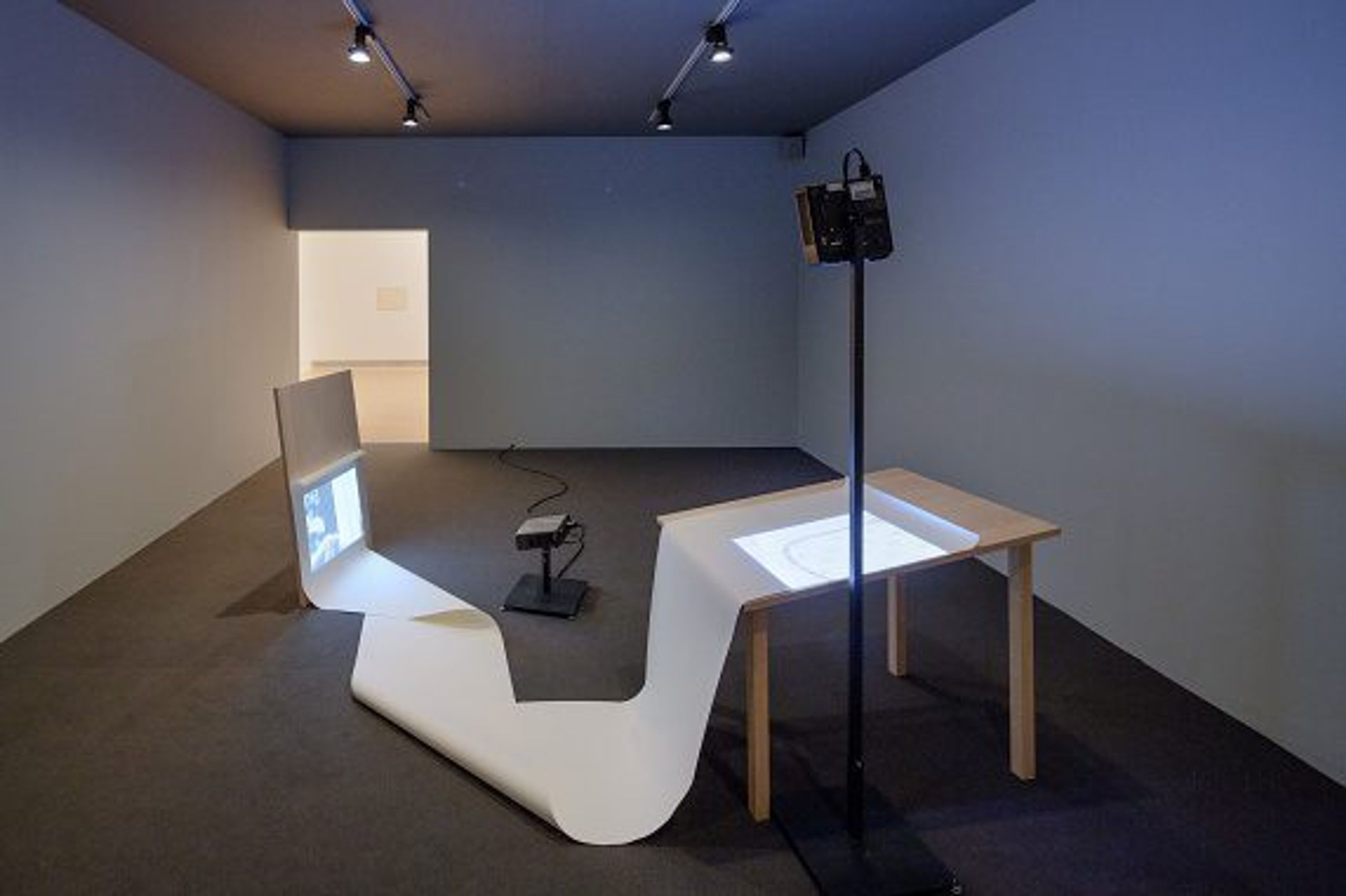 Vanishing Point, 2013 Two birch wood structures, paper and two Super 8 films transferred to HD video Installation view 8th Berlin Biennale, 2014
