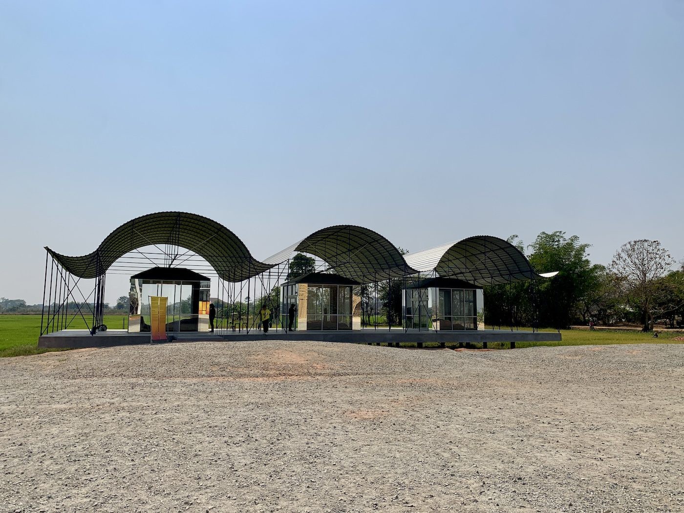 all(zone) / Rachaporn Choochuey, Between Roof & Floor, 2023. For this biennale, all(zone) built a gallery located in the middle of a rice field. In response to the space limitations of modern art institutions, they propose a solution that allows the gallery space to be flexible. Photo: C&