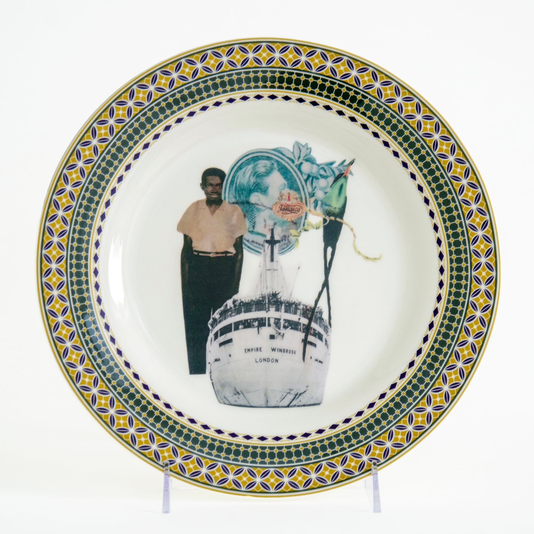 A decorative plate featuring a collage of a standing person, the ship Empire Windrush, and other symbolic imagery, surrounded by an ornate border.