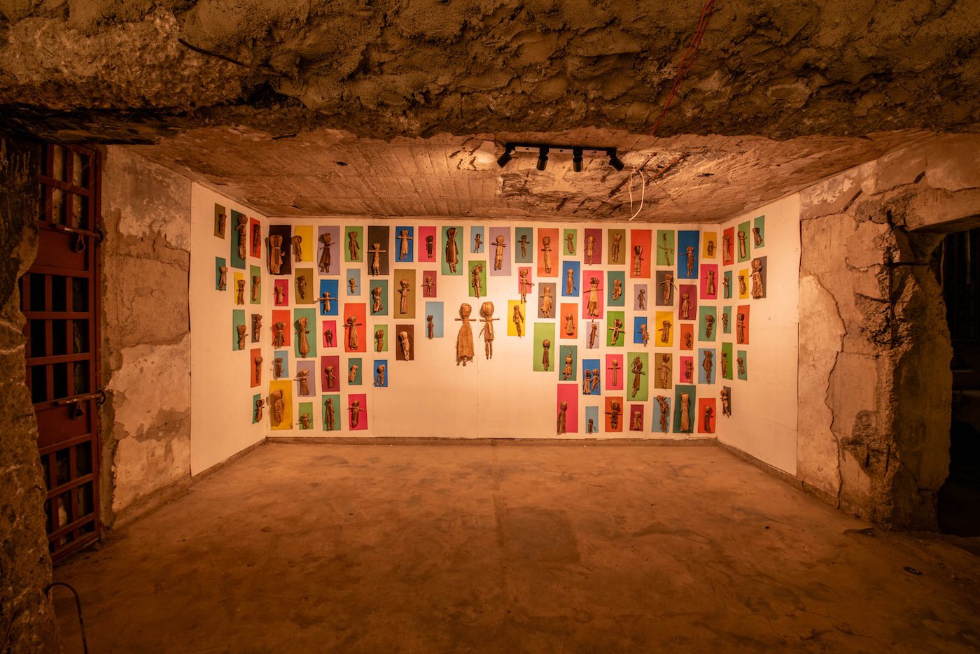 Yiga Joshua, Cave of dolls, 2022-2023, banana fiber dolls on colored boards, variable dimensions. at Silent Invasions: The Art of Material Hacking. Photo: Atiko Anthony
