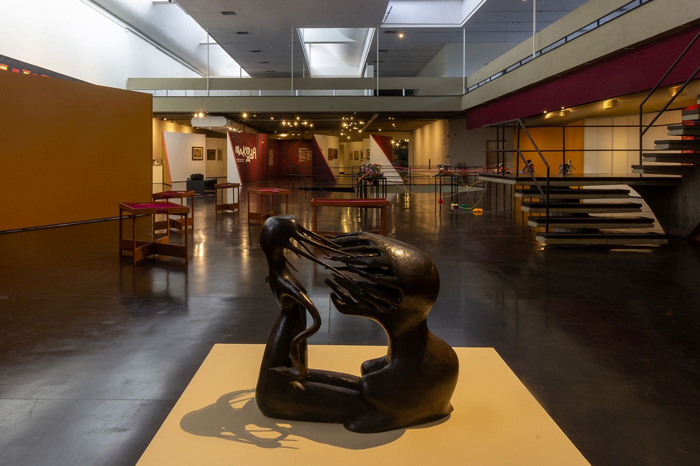 View of exhibition with works by Cinthia Marcelle (Wound Meditation or The School of Knives [Nakoada version], 2022, wood, hinge, Styrofoam, velvet, commission) and Maria Martins (The impossible, 1940s, bronze). Photo: Fábio Souza/MAM Rio