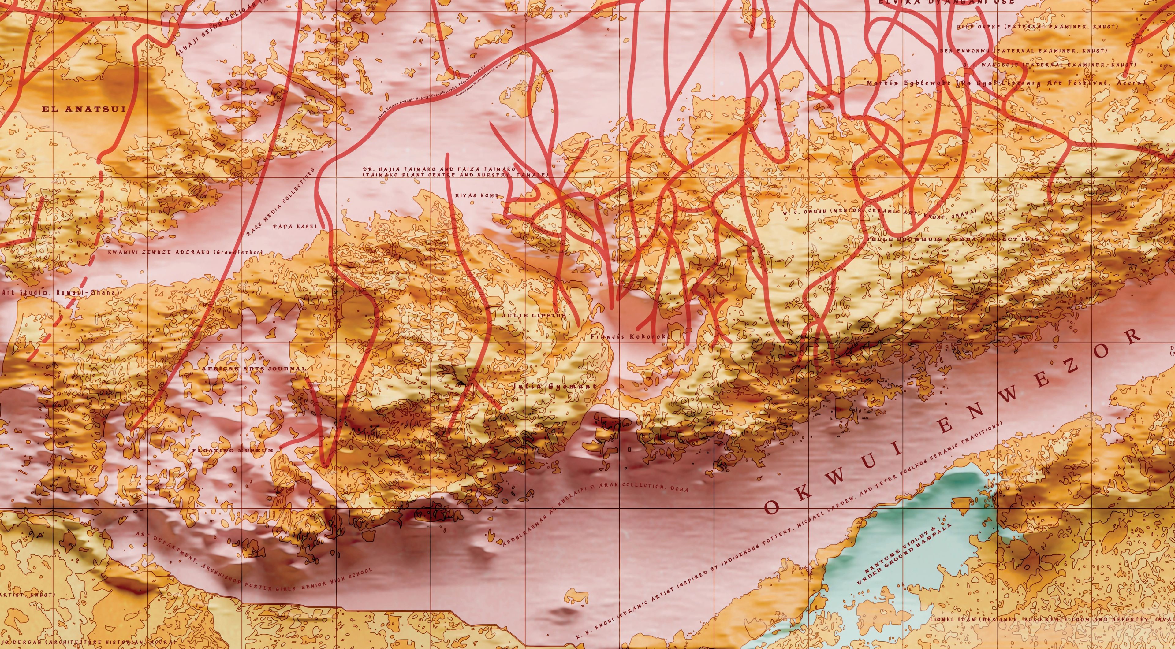 Relief map of brown mountainous terrain with an intricate network of red lines and a light blue body of water.