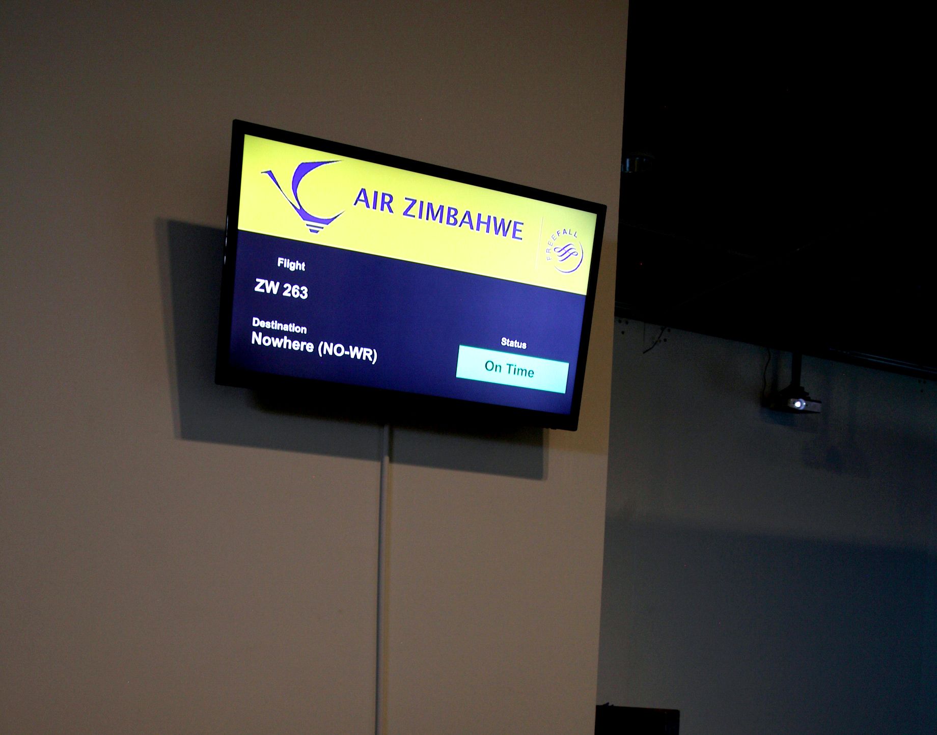 Lucia Nhamo, Free Fall: A Chronology of the Zimbabwe Dollar, 2015. Installation detail. 3-channel video animation, custom-packaged peanuts, LED screen, glass case, defunct currency, video, live performance. Courtesy of the artist