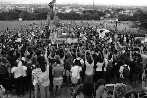 David Goldblatt, The dethroning of Cecil John Rhodes, after the throwing of human faeces on the statue and the agreement of the University to the demands of students for its removal. The University of Cape Town, 9 April 2015, 2015, silver gelatin print