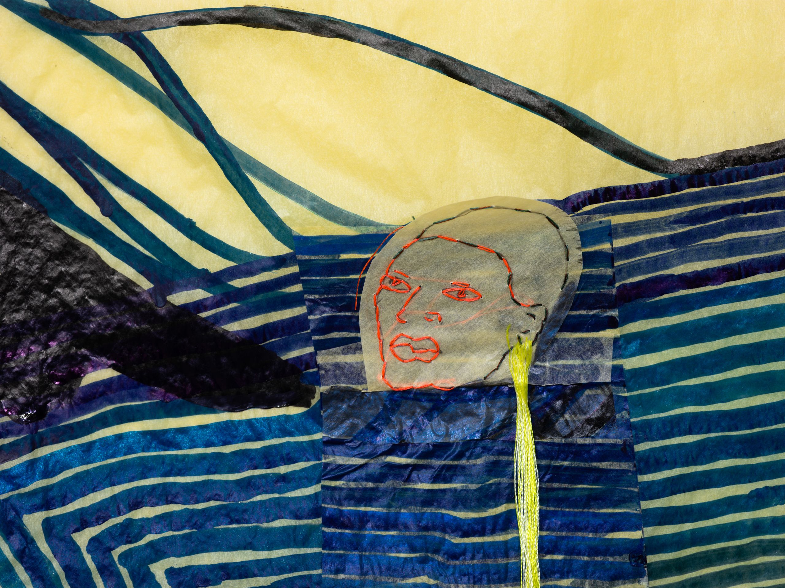 Textile art: a stylized embroidered face with red features and a yellow string from its ear, on blue striped fabric and a yellow background.
