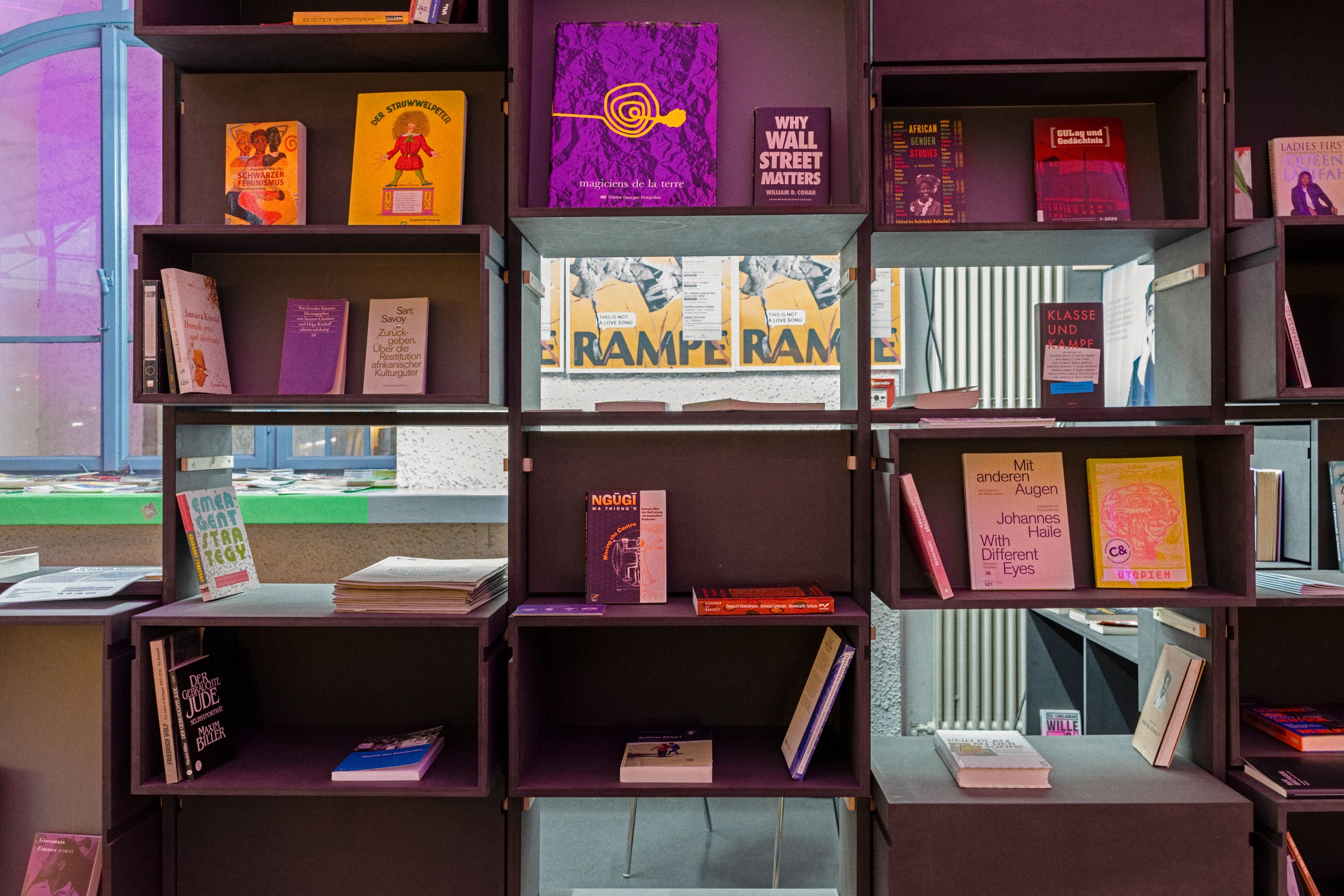 Modular dark shelves filled with books.