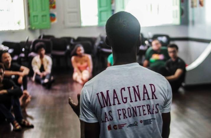 A rear photo of RCHD’s artistic director - Daphné Menard - speaking in front of a group. Credits: ACSS.